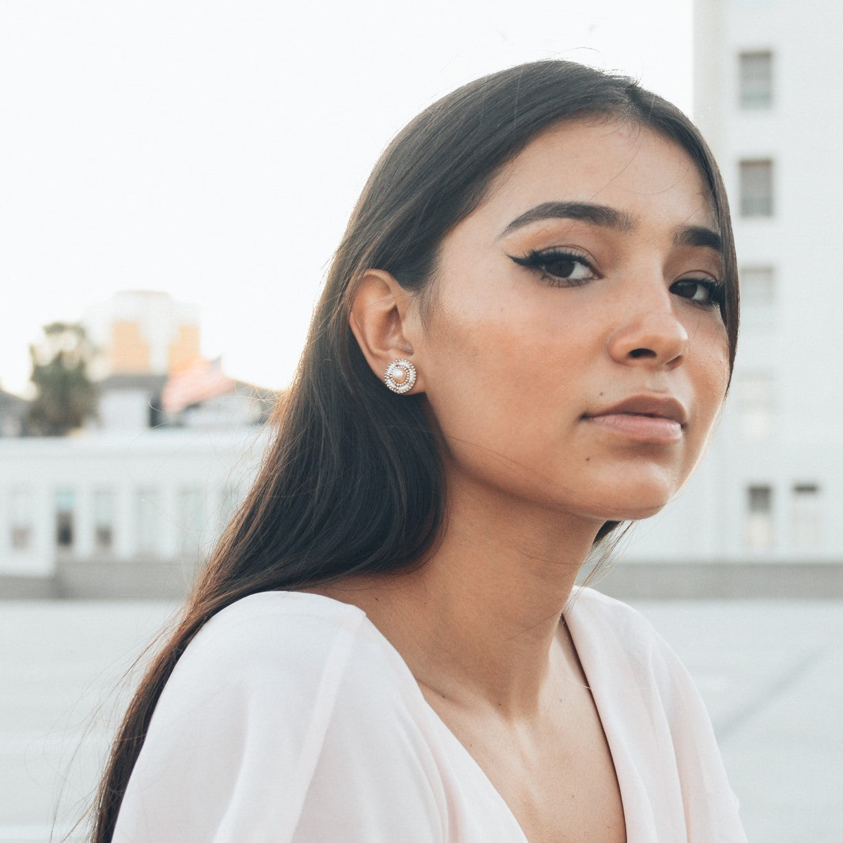 Model Wearing Cheyanne Symone's Ivory Freshwater Pearl Stud Beaded Earrings