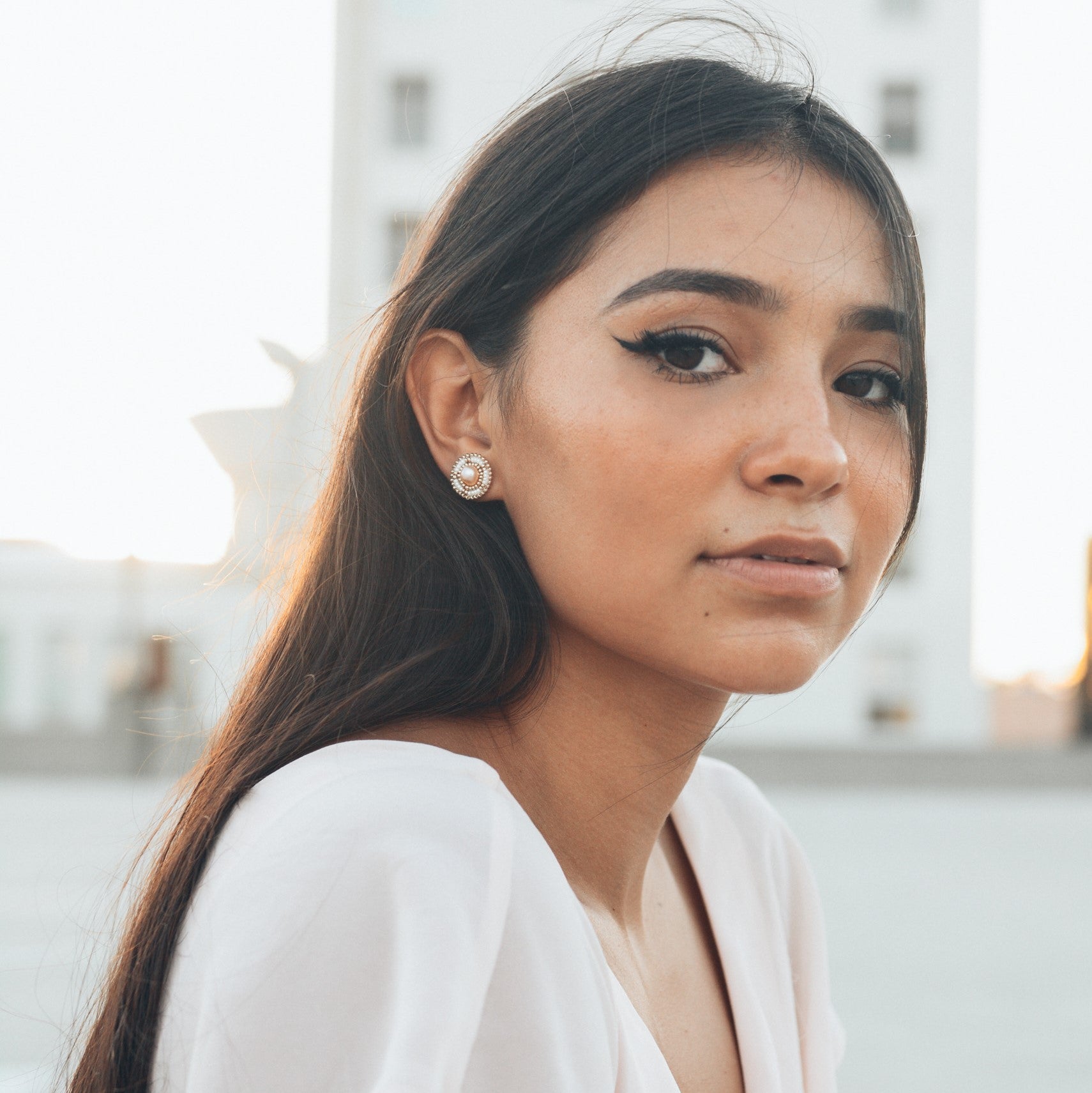 Model Wearing Cheyanne Symone's Ivory Freshwater Pearl Stud Beaded Earrings