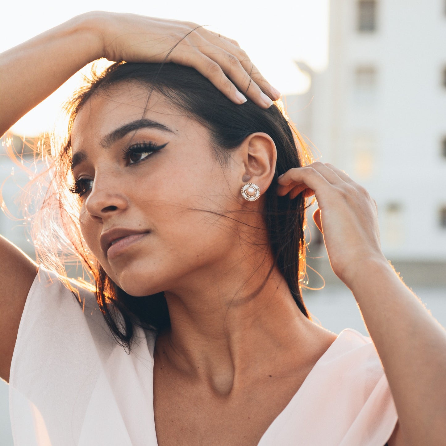 Model Wearing Cheyanne Symone's Ivory Freshwater Pearl Stud Beaded Earrings