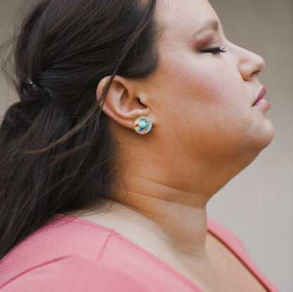 Jana Wearing Cheyanne Symone and QueerKwe’s Collaborative Mini Two-Spirit Pride Stud Earrings